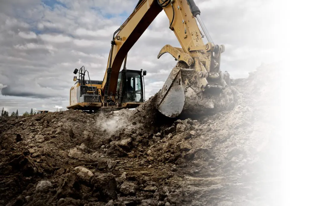 Excavator breaks ground during pre construction